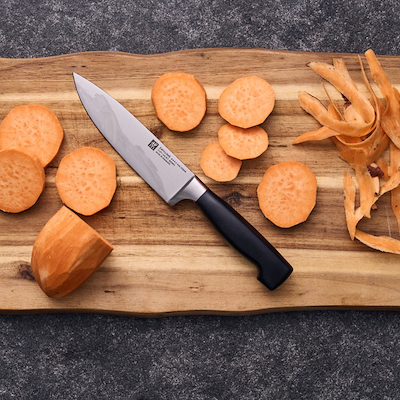 Zwilling Four Star kokkekniv sort 16 cm